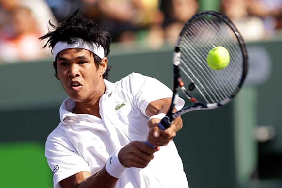 Somdev Devvarman, of India, returns to Novak Djokovic, of Serbia, during the Sony Open tennis tournament in Key Biscayne, Fla.