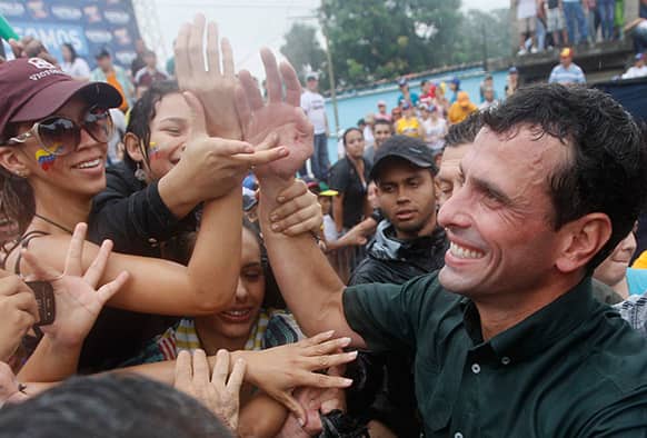 Venezuela`s opposition presidential candidate Henrique Capriles greets supporters during a campaign rally in San Felipe, Yaracuy State, Venezuela.