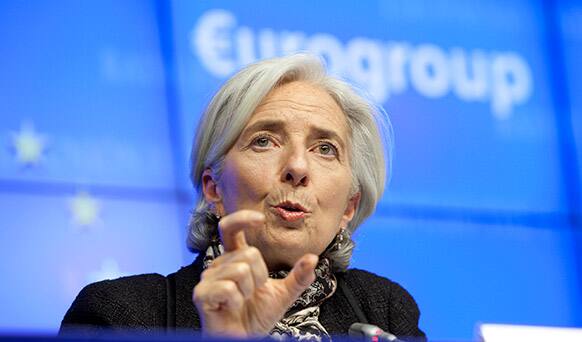 Managing Director of the International Monetary Fund Christine Lagarde gestures while speaking during a media conference after an emergency eurogroup meeting in Brussels.