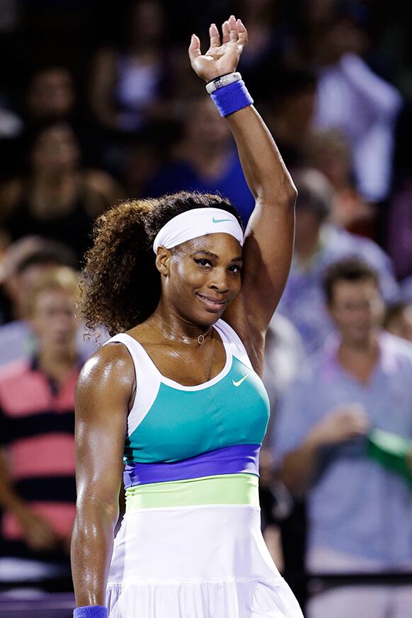 Serena Williams celebrates after defeating Ayumi Morita, of Japan, 6-3, 6-3, during the Sony Open tennis tournament, in Key Biscayne, Fla.
