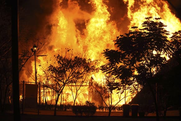 A fire rages in a section of the Takilhsukut park, where the Cumbra Tajin music festival was being held in Papantla, Mexico.
