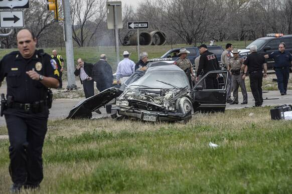 Emergency personnel are on the scene of a crash and shootout with police involving the driver of a black Cadillac with Colorado plates in Decatur, Texas.