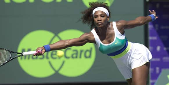 Serena Williams, of the United States, reaches for a return to Flavia Pennetta, from Italy, during the Sony Open tennis tournament.