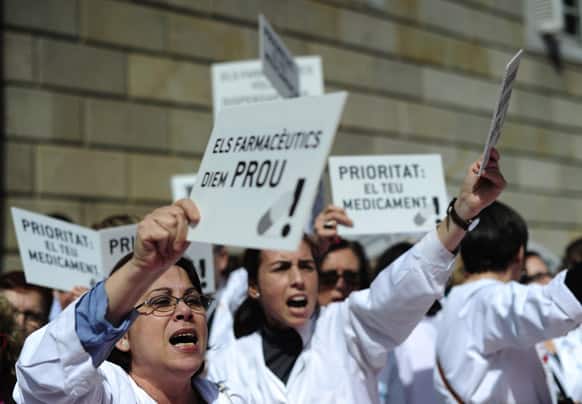 Pharmacists protest in Sant Jaume square against their working conditions with the Catalonia regional government in Barcelona, Spain.