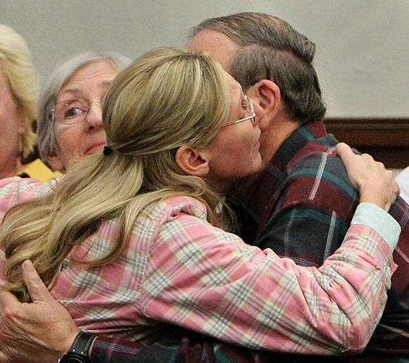 Jack Kern, right, embraces his daughter, Barbara, after the jury recommended death for Richard Beasley in the courtroom of Summit County Common Pleas Court Judge Lynne Callahan, in Akron, Ohio.