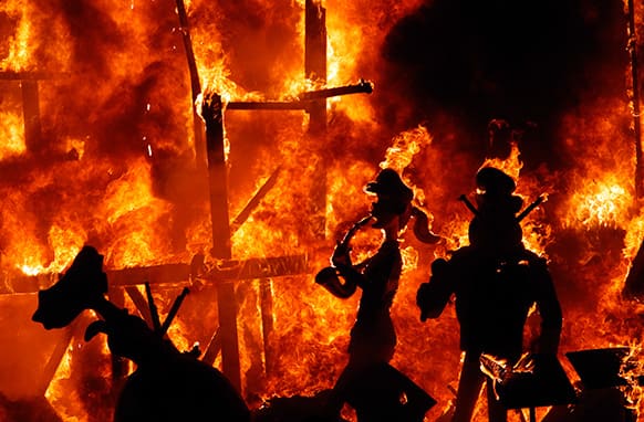 Satirical sculptures are burned during the traditional Fallas Festival, in Valencia, Spain, early Wednesday, March 20, 2013.