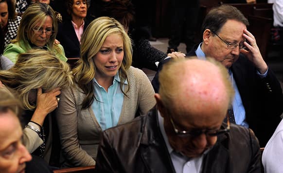 Lindsey Lowe`s parents, Paula, left, and Mark Lowe, and her sister, Lacey, react as they listen to the jury return a guilty verdict for Lindsey during her murder trial in Gallatin, Tenn.
