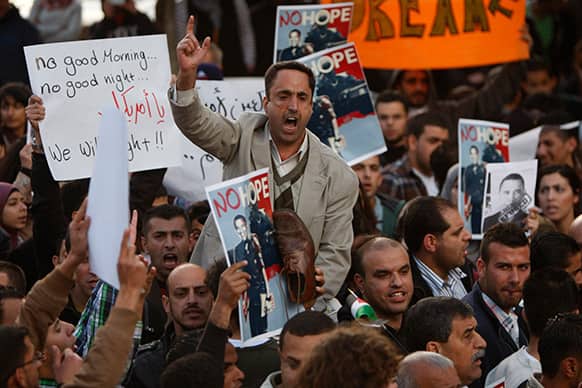 Palestinian chant slogans during a protest against US President Barack Obama`s visit in the West Bank city of Ramallah.