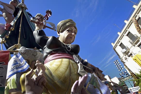 A Falla, or Ninot, a gigantic sculpted satirical structure made of cardboard and other materials, caricaturing German Chancellor Angela Merkel, during an exhibition for the Fallas Festival, in Valencia, Spain.