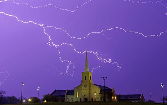 Lightning steaks across the sky behind the Young Meadows Presbyterian Church in Montgomery, Ala. Strong storms moved across much of Alabama on Monday, bringing hail, high winds, and heavy rainfall as a cold front passed through the state.