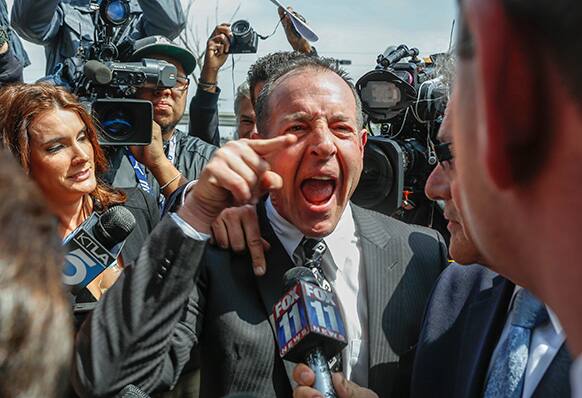 Michael Lohan, father of actress Lindsay Lohan, speaks to the media as he leaves the Los Angeles County.