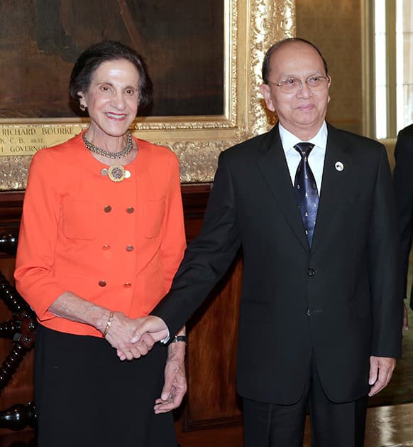 Myanmar President Thein Sein, right, shakes hands with Marie Bashir, governor of New South Wales at Government House in Sydney, Australia.