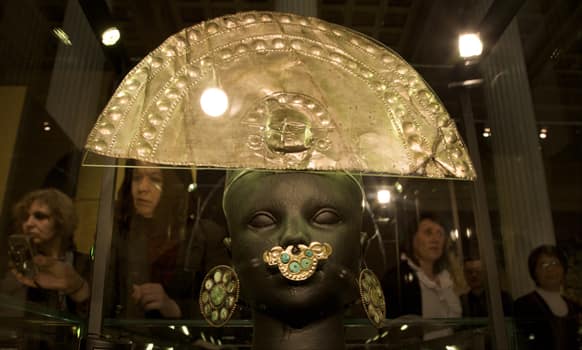 Headdress, ear drops and nose jewelry are on display during the opening of the