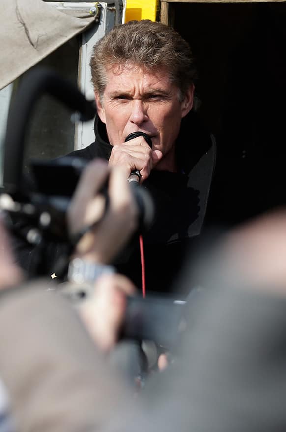 US actor David Hasselhoff speaks to the crowed from a truck as he attends a protest against the removal of a section of the East Side Gallery, a historic part of the former Berlin Wall, in Berlin.