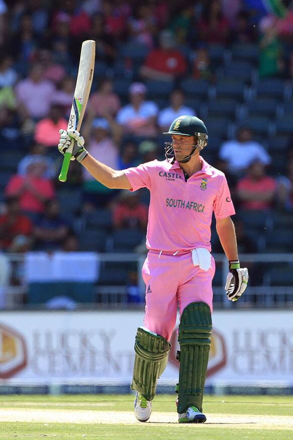 South Africa`s captain AB de Villiers raises bat after reaching his half century during their 3rd One Day International cricket match against Pakistan at Wanderers stadium in Johannesburg, South Africa.