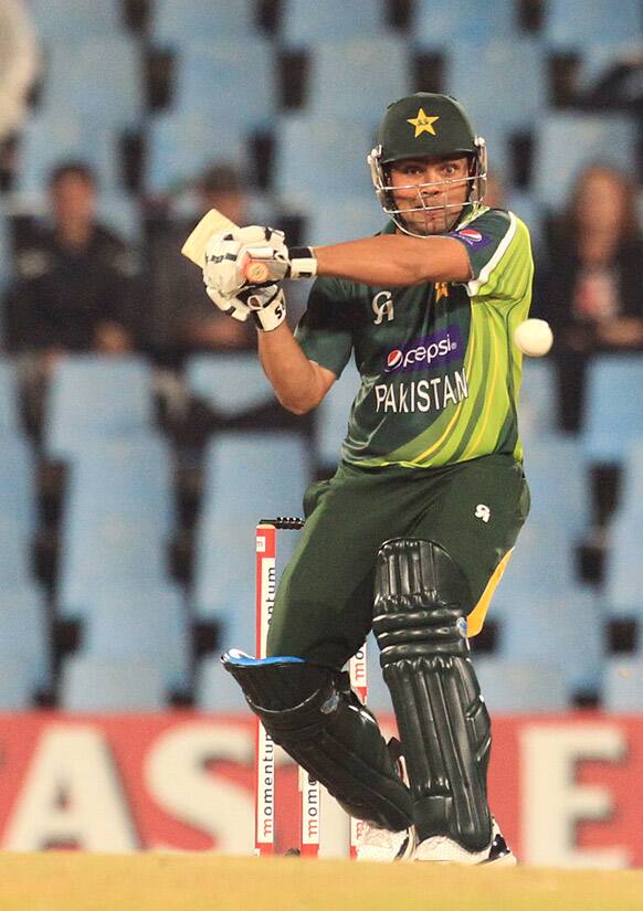 Pakistan`s batsman Akmal Kamran plays a shot off South Africa`s Ryan McLaren, unseen, during their 2nd One Day International cricket match at Centurion Park in Pretoria, South Africa.