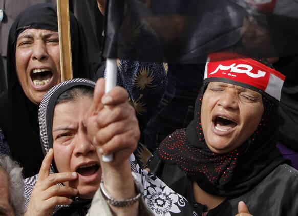 Supporters of Egypt`s military shout anti-Muslim Brotherhood slogans during a protest in front of the Unknown Soldier memorial in Cairo, Egypt.