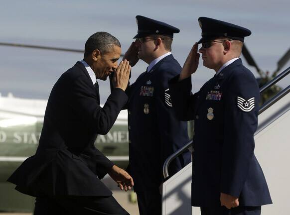 President Barack Obama salutes as he prepares to board Air Force One before his departure from Andrews Air Force Base.