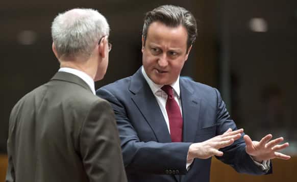 British Prime Minister David Cameron speaks with European Council President Herman Van Rompuy during a round table meeting at an EU summit in Brussels.