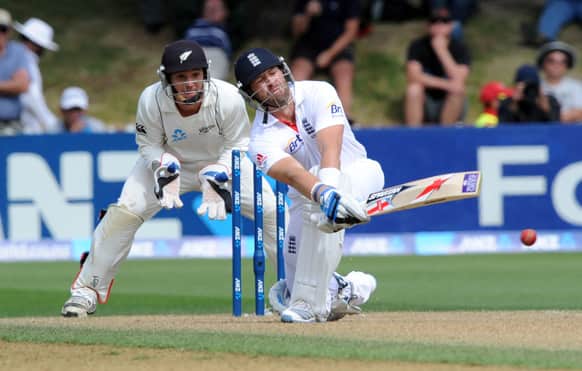 England`s Matt Prior sweeps to a boundary in front of New Zealand wicketkeeper BJ Watling, left, on the second day of the second international cricket test in Wellington, New Zealand.