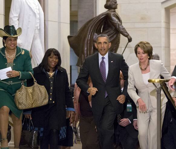 President Barack Obama and House Minority Leader Nancy Pelosi, D-Calif., leave a meeting with House Democrats at the Capitol, in Washington.