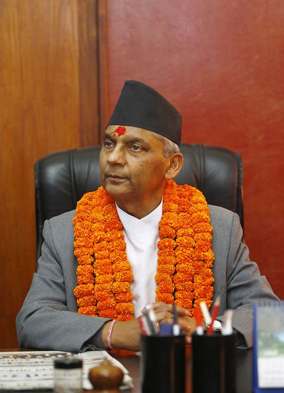Nepal`s newly-appointed Prime Minister Khilraj Regmi assumes office after being sworn in in Katmandu, Nepal.