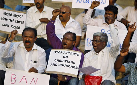 Christians hold placards and shout slogans during a protest in Bangalore against Hindu right wing Bajrang Dal for allegedly attacking Christian worshippers in Udupi in north Karnataka.