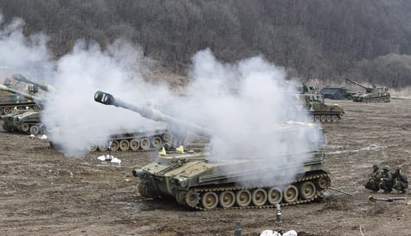 A South Korean marine K-55 self-propelled howitzer fires during an exercise against possible attacks by North Korea near the border village of Panmunjom in Paju, South Korea.