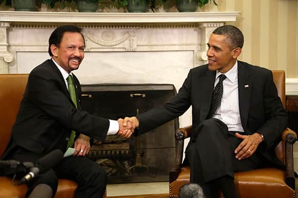 President Barack Obama shakes hands with Brunei’s Sultan Hassanal Bolkiah during their meeting in the Oval Office of the White House in Washington.