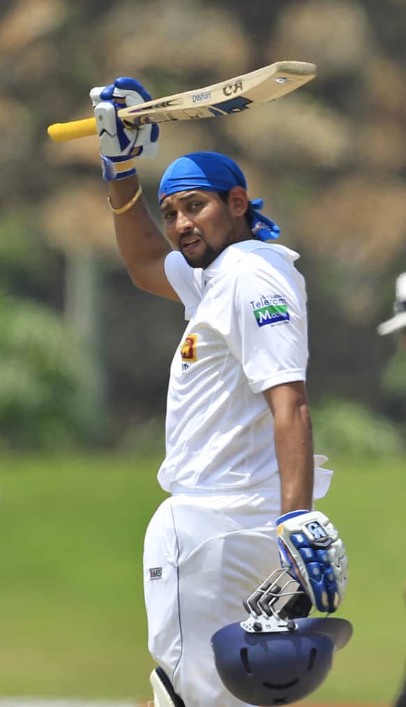 Sri Lanka`s Tillakaratne Dilshan acknowledges the crowd after scoring a century during the fifth day of their first test cricket match against Bangladesh in Galle, Sri Lanka.