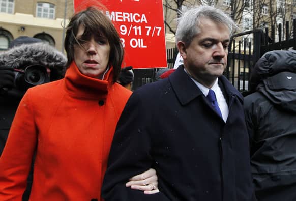 Britain`s Former Energy Secretary Chris Huhne, right, and his partner Carina Trimingham arrive for his sentencing hearing on perverting the course of justice, at Southwark Crown Court in London.