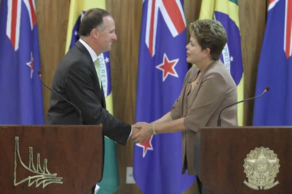 New Zealand`s Prime Minister John Key, left, shakes hands with Brazil`s President Dilma Rousseff during a joint press conference at the Planalto presidential palace in Brasilia, Brazil.