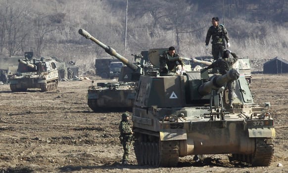 South Korean Army soldiers work on their K-9 self-propelled artillery vehicle during an exercise against possible attacks by North Korea near the border village of Panmunjom in Paju, South Korea.