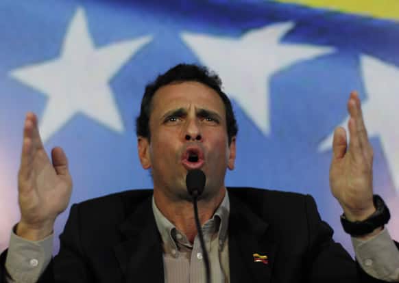 Opposition leader Henrique Capriles gestures during a press conference in Caracas, Venezuela. Capriles announced he will run in election, scheduled for April 14th, to replace late President Hugo Chavez, who died of cancer on March 5.