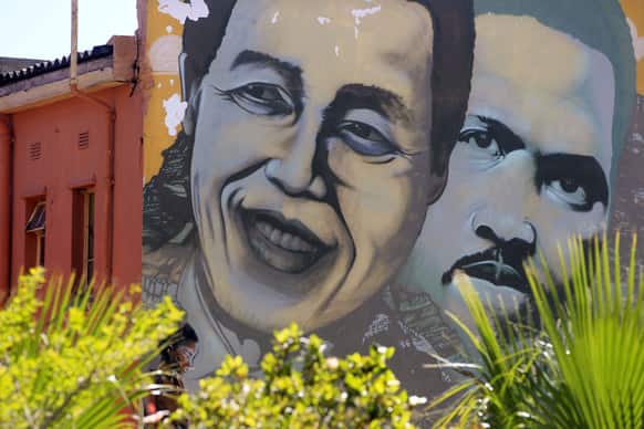 Former South African President Nelson Mandela, left, is pictured on a mural with South African apartheid freedom fighter Steve Biko, right, in the city of Cape Town, South Africa.