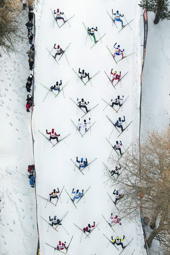 This aerial view taken from a helicopter, the pack of skiers climb a hill during the Engadine cross country skiing marathon from Maloja to S-Chanf in south Eastern Switzerland