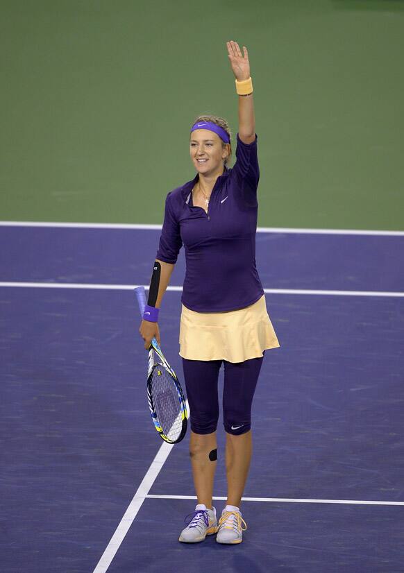 Victoria Azarenka, of Belarus, waves to fans after defeating Daniela Hantuchova, of Slovakia, at the BNP Paribas Open tennis tournament, in Indian Wells, Calif.