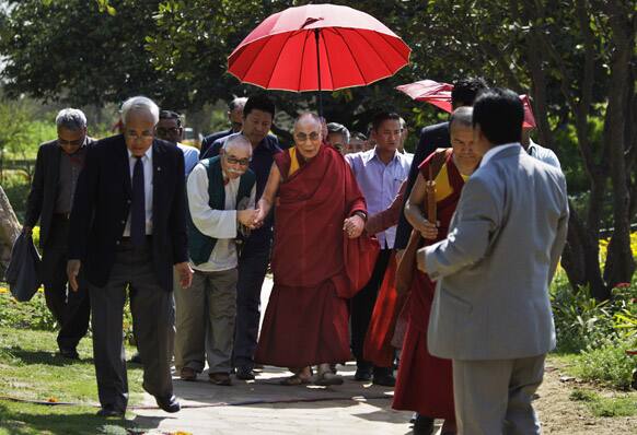 Tibetan spiritual leader the Dalai Lama arrives to give a religious talks at a park in New Delhi.