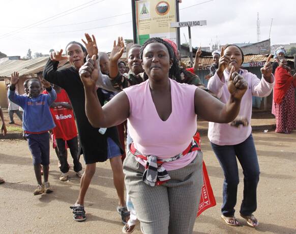 Supporters of Kenyan presidential candidate Uhuru Kenyatta celebrate what they perceive is an election win for him in Kawangware, Nairobi, Kenya.