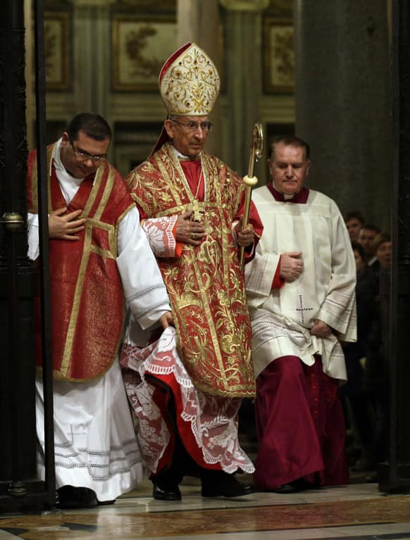 Cardinal Dario Castrillon Hoyos, center, arrives to celebrate a mass for the election of the new pope, in St. Mary Major Basilica, in Rome.
