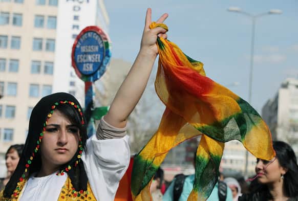 Turkish Kurdish women protest domestic violence against women, war and discrimination as they march to commemorate the International Women`s Day in Ankara.