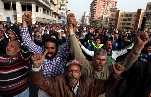 Egyptians chant slogans as others carry the coffin of Abd Alhaleem Mohanna, 23, who was killed on March 5, 2013 during clashes with riot police, during his funeral in Port Said, Egypt.