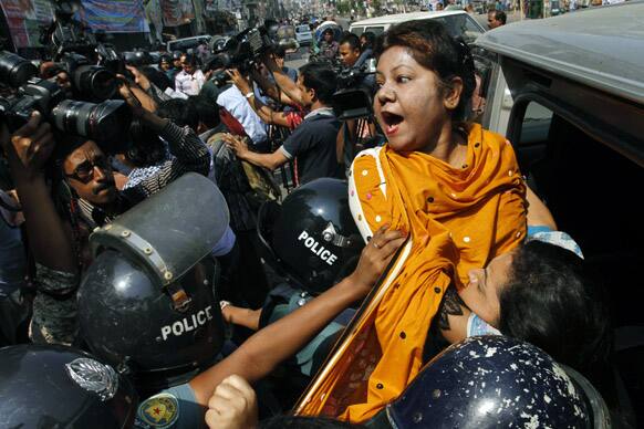 Bangladeshi police officials detain opposition Bangladesh Nationalist Party (BNP) lawmaker Rehena Akter Ranu during a nationwide strike in Dhaka.