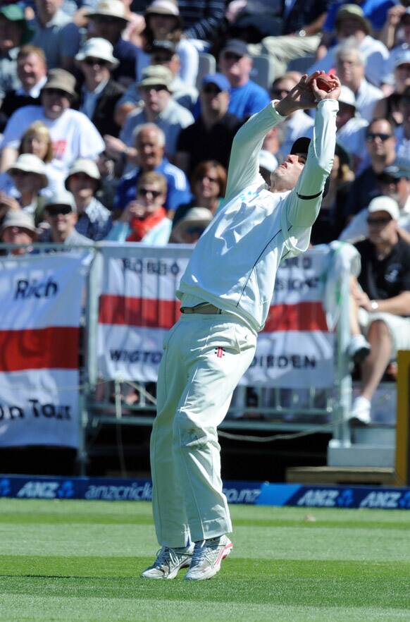 New Zealand`s Hamish Rutherford takes the catch to dismiss England`s Steven Finn for 20 off the bowling of Neil Wagner on the second day of the 1st international cricket test at University Oval in Dunedin.