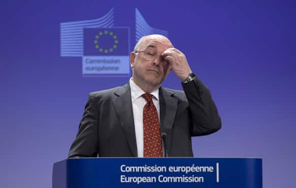 European Commissioner for Competition Joaquin Almunia pauses before answering a question during a media conference at EU headquarters in Brussels.