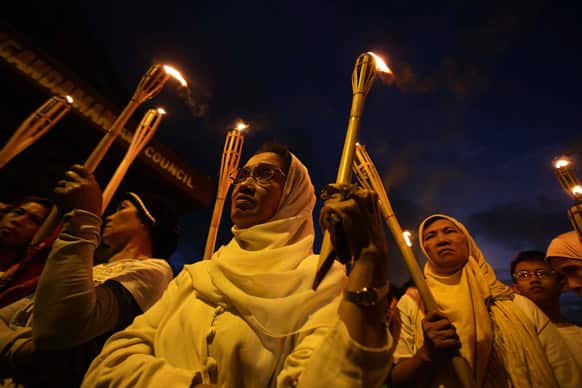 Filipino Muslim women listen during a rally at the Maharlika village in suburban Taguig, south of Manila, Philippines. The group is calling for a peaceful resolution on the current crisis between the Philippines and Malaysia as they deal with a Philippine royal Muslim clan who claims ownership of Sabah.