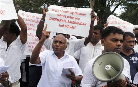 Sri Lankan government supporters representing the Dead and Missing Persons` Parents Front march outside the UN office in Colombo.