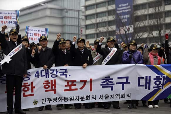 South Korean protesters shout slogans during a rally demanding the Korean Peninsula`s peaceful unification and denouncing North Korea`s nuclear test near the U.S. Embassy in Seoul.