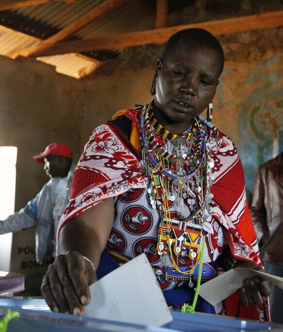 A Masai woman casts her vote in a general election in Kajiado West, some 60 kilometers (37 miles) from Nairobi, Kenya.