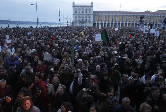 Demonstrators crowd Lisbon`s Comerio square during a protest against austerity measures taken by the Portuguese government in exchange of a euro 78 billion ($101 billion) international bailout needed in 2011.